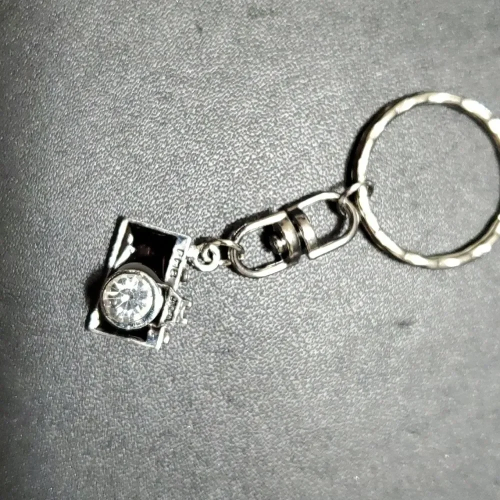 Silver tone camera key fob